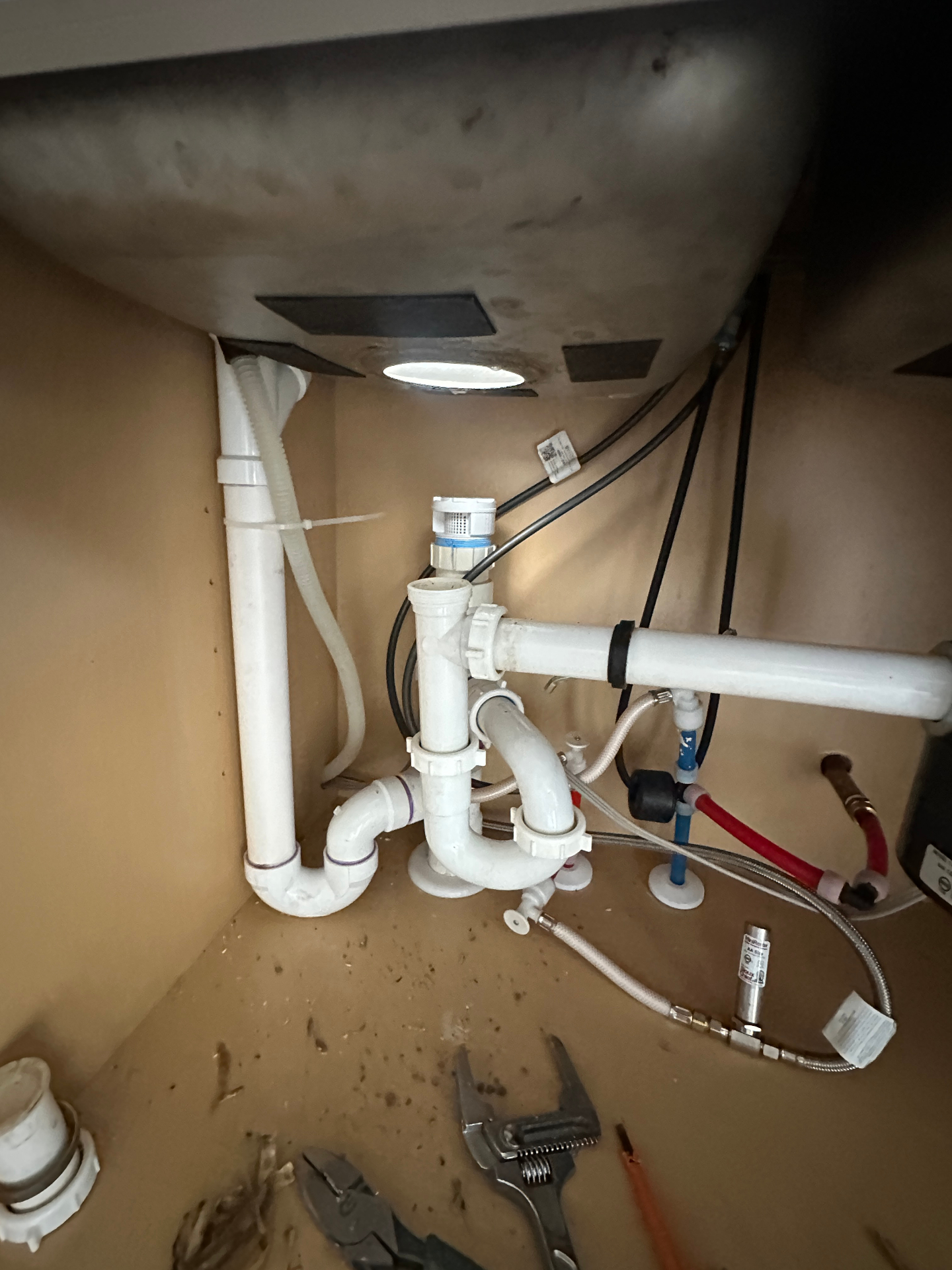 New garbage disposal drain plumbing installed